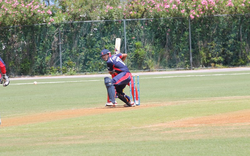 Paras Khadka batting for Nepal, wearing shirt number 77. Photo: Krish Dulal / Wikimedia Commons (CC BY-SA 3.0)