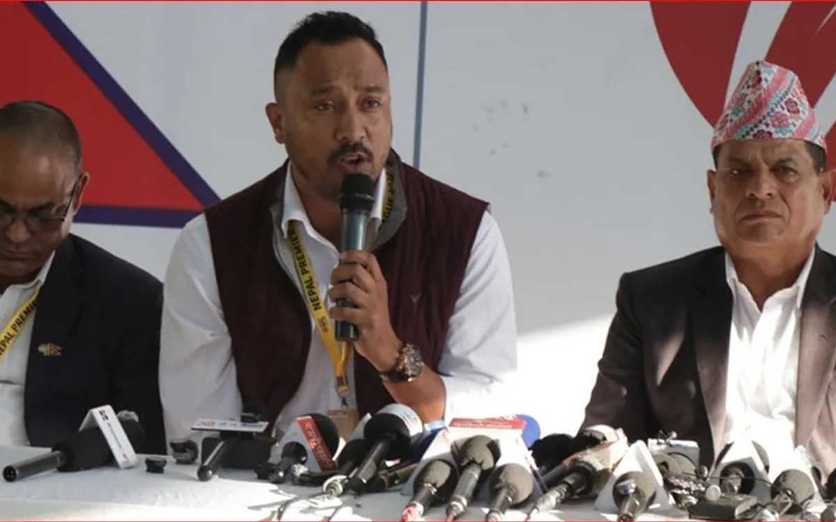 CAN secretary Paras Khadka speaking at a press conference on the Nepal Premier League, with fellow officials seated beside him