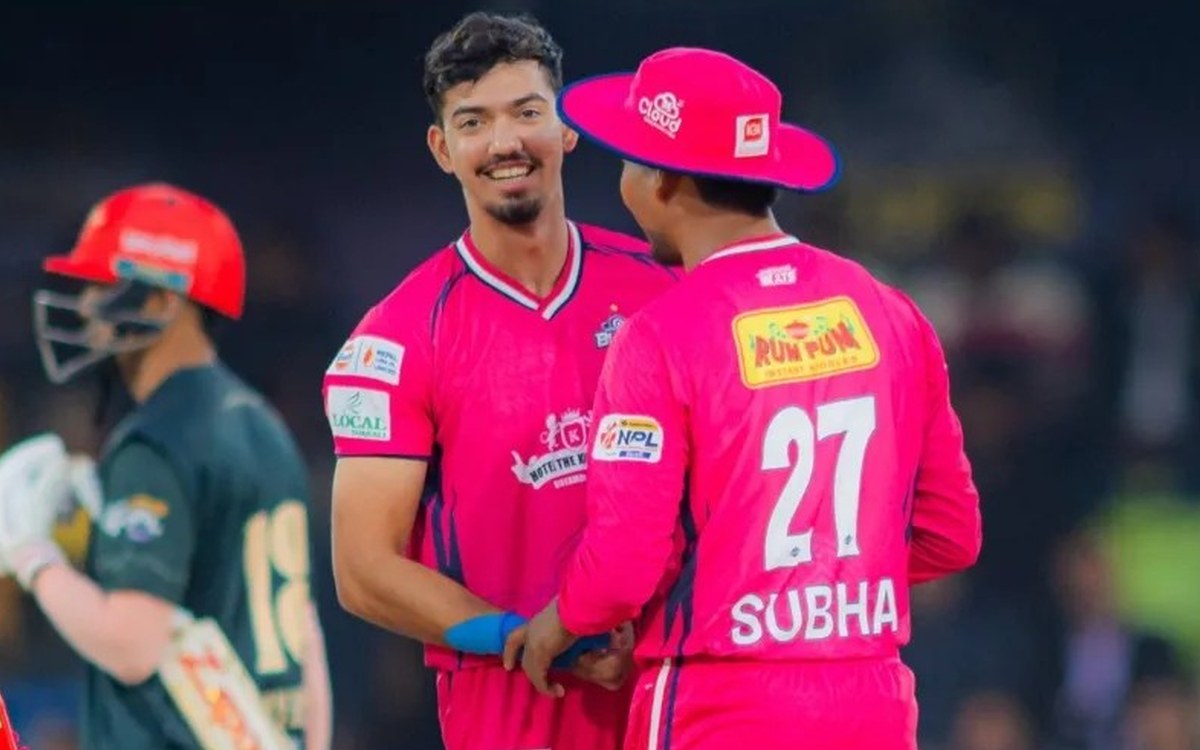 Two Janakpur Bolts players in pink jerseys on the field during an NPL match