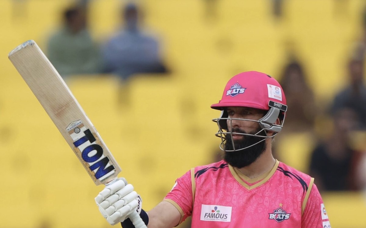 Moeen Ali raises his bat in the Janakpur Bolts pink kit during NPL Season 3 Match 5 against Kathmandu Gorkhas at TU Ground, Kirtipur