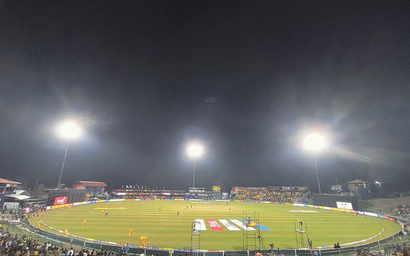 The TU International Cricket Ground in Kirtipur under floodlights during a night match, whose access roads will be blacktopped within three months. Photo: Janak Bhatta / Wikimedia Commons (CC BY-SA 4.0)