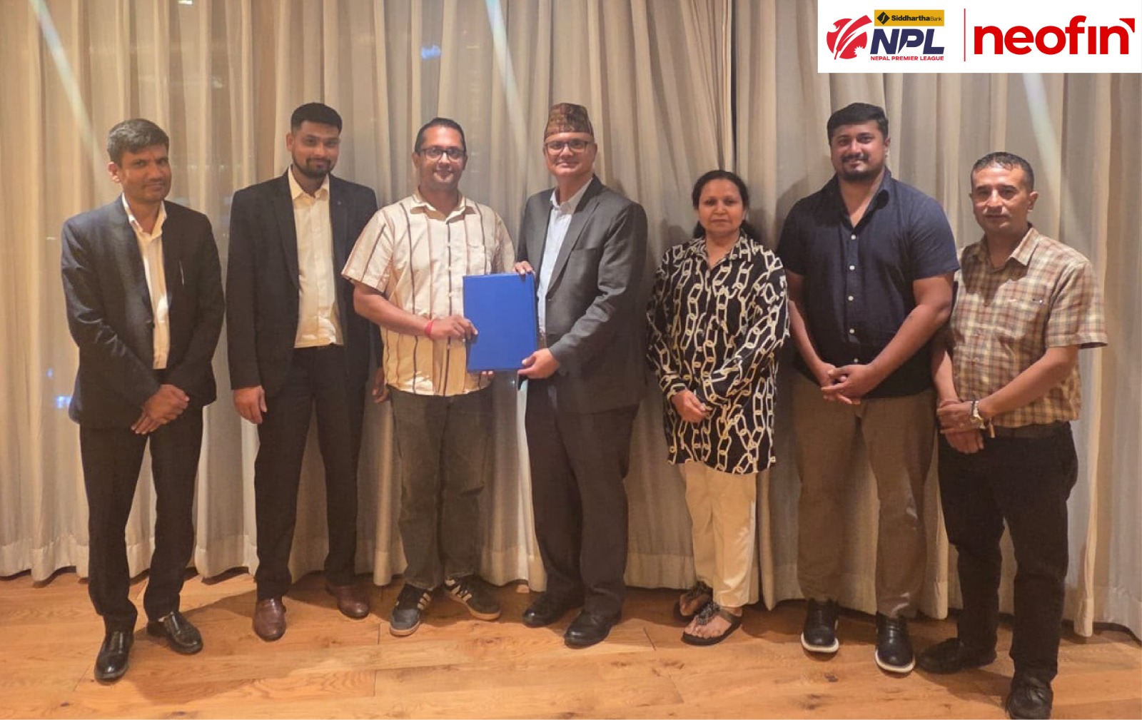 Officials pose with the signed agreement at the Neofin and Nepal Premier League partnership announcement. Photo: Makalu Khabar