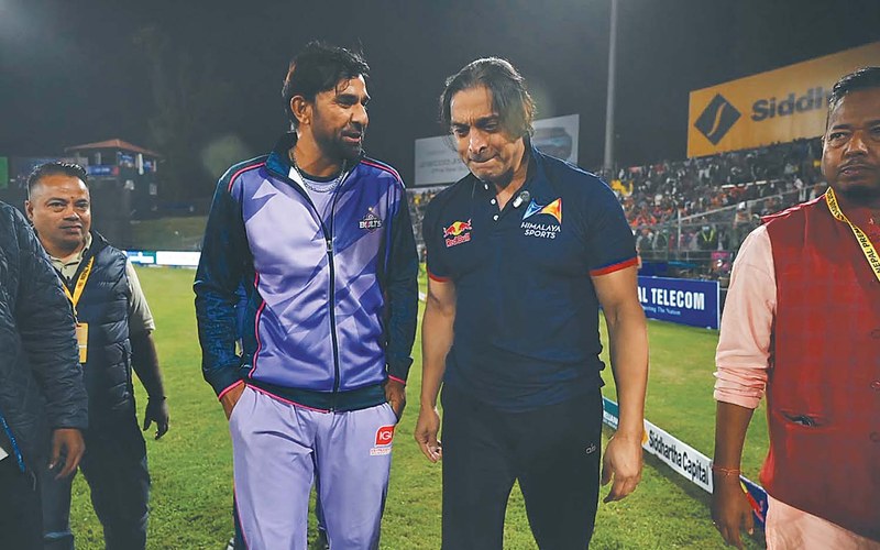 Shoaib Akhtar walks on the field at TU Ground, Kirtipur, alongside a Janakpur Bolts representative during the NPL Season 3 preview. Photo: Kathmandu Post