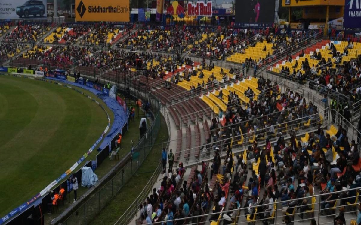 Large sections of empty yellow and red seats at TU International Cricket Ground in Kirtipur during an NPL Season 3 match