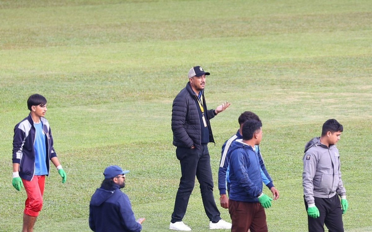 Ground staff and officials on the outfield at TU Ground in Kirtipur on Saturday evening