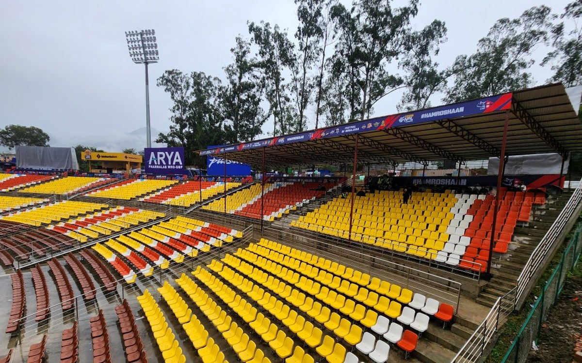 Rain-soaked new stands at the TU Ground in Kirtipur under grey skies during the NPL waterlogging
